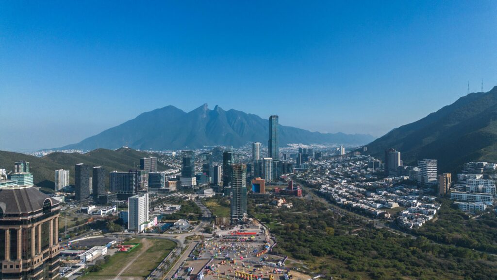 Explore the stunning aerial view of Monterrey, featuring the iconic Cerro de la Silla and modern skyline.
